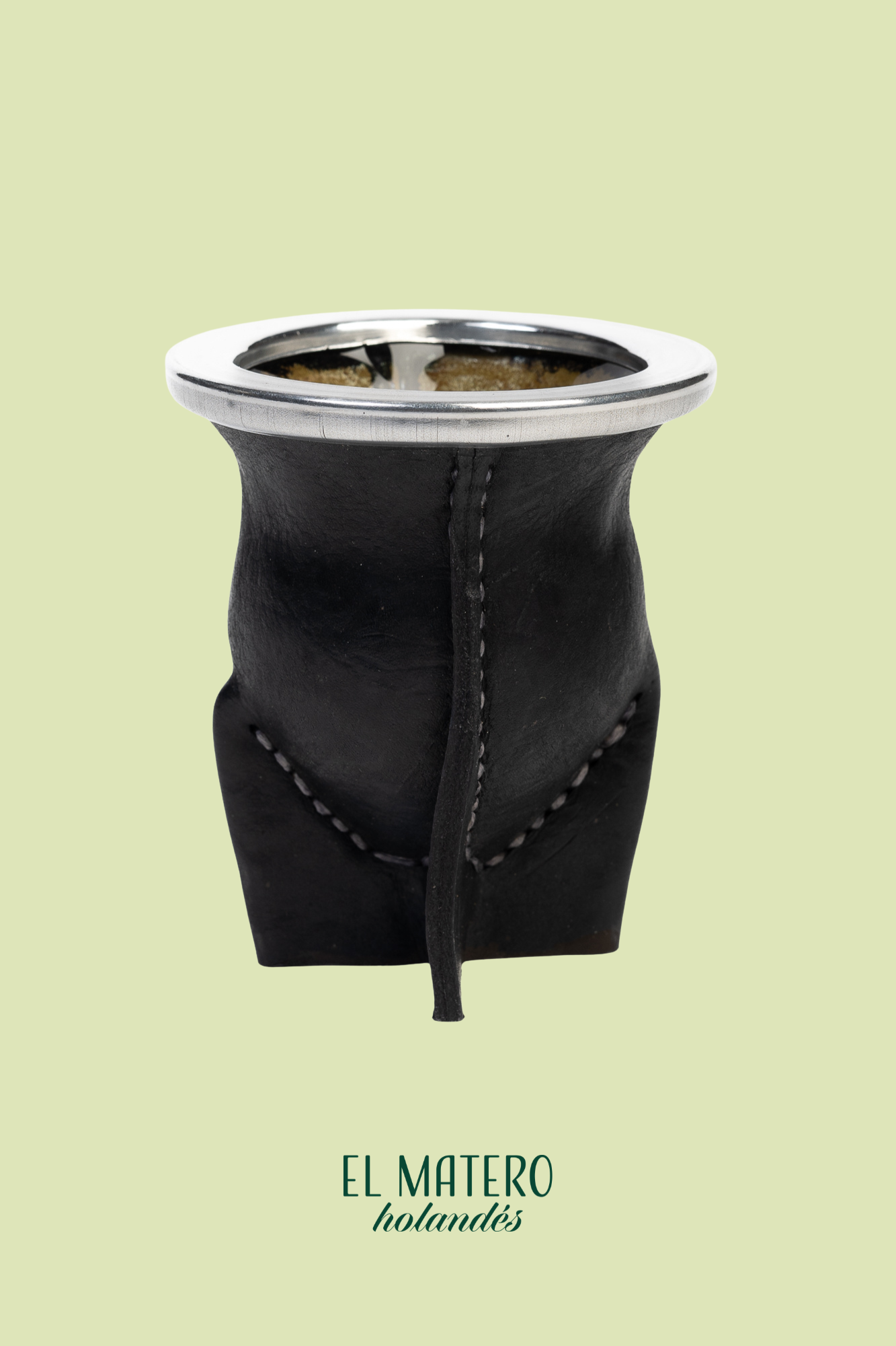 Black leather Mate with silver top on a light green background, featuring 'El Matero' branding.